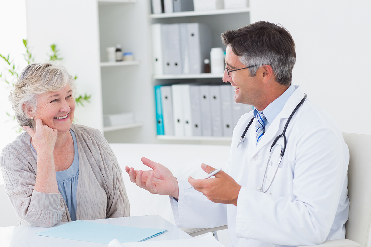 Doctor talking to elderly patient