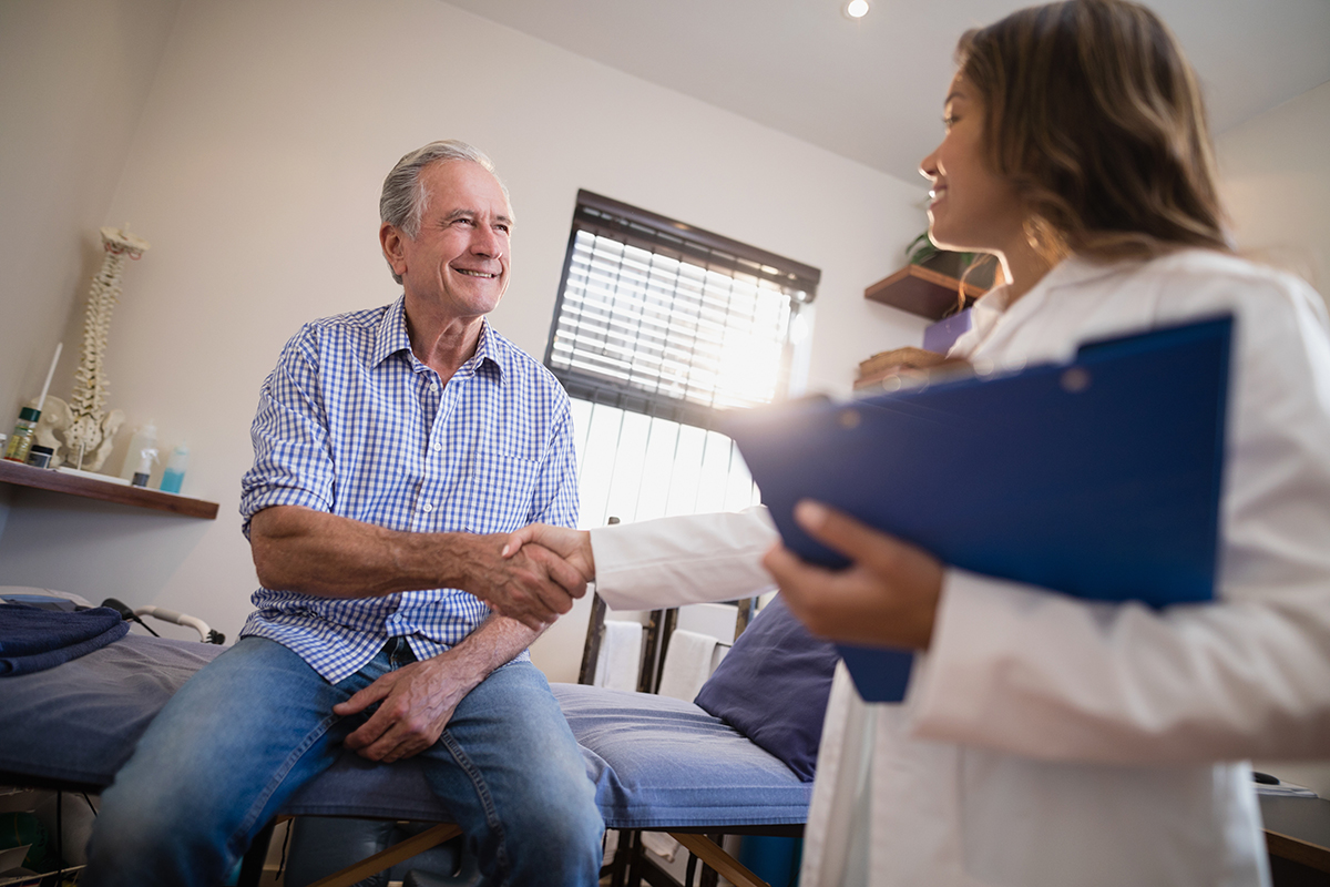 Doctor talking to senior patient