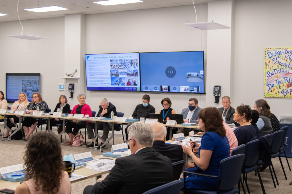 Board members sitting at a table during a meeting